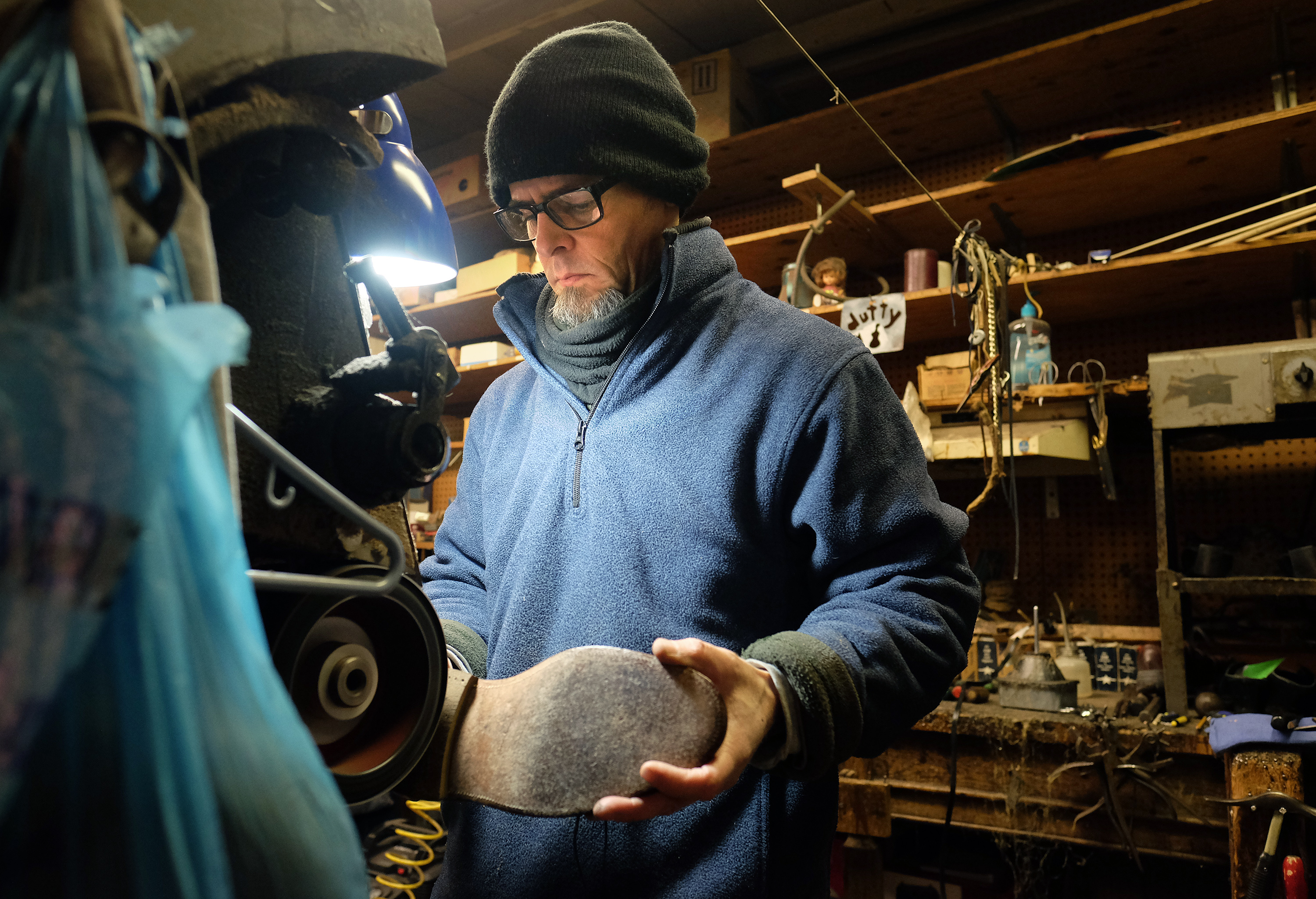 Jerome West works on a pair of shoes at Graham's Shoe Service Wednesday Nov. 23, 2016. (Photo by Norm Shafer).